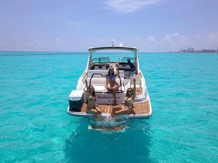  Yacht Photos Pics 2017 Sea Ray 350 SLX boat with people enjoying turquoise waters.