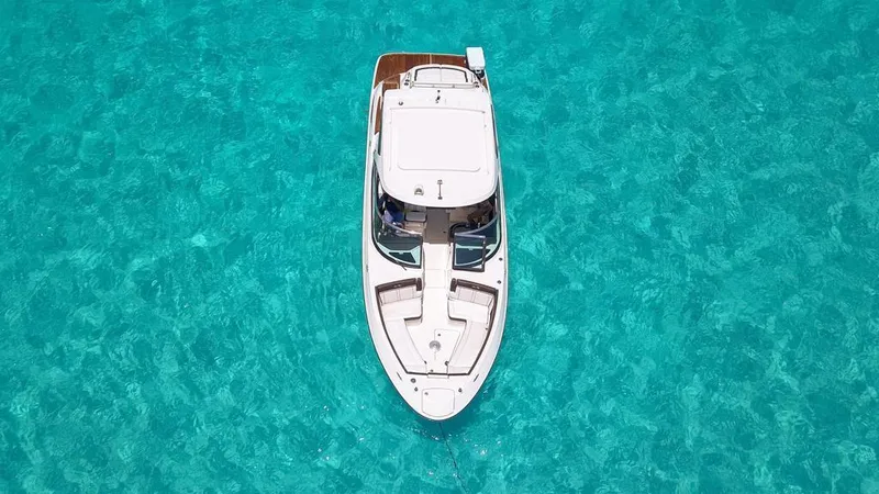 Yacht Photos Pics 2017 Sea Ray 350 SLX boat on clear turquoise water, aerial view.
