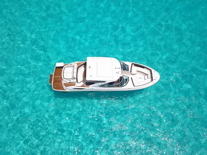  Yacht Photos Pics 2017 Sea Ray 350 SLX boat on clear turquoise water, aerial view.