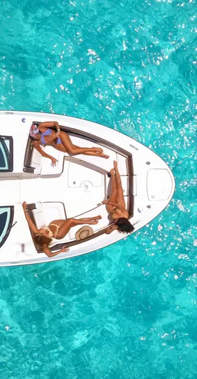  Yacht Photos Pics 2017 Sea Ray 350 SLX boat with people relaxing on turquoise water.