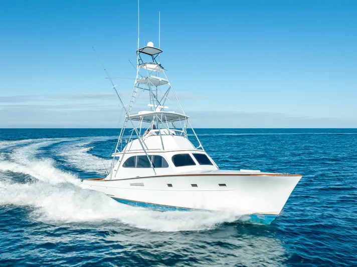 Andiamo Yacht Photos Pics 1979 Merritt 46 yacht cruising on open blue ocean.