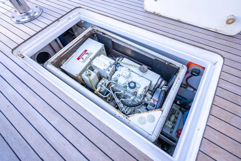 Andiamo Yacht Photos Pics Engine compartment of a 1979 Merritt 46 yacht, showcasing mechanical components.