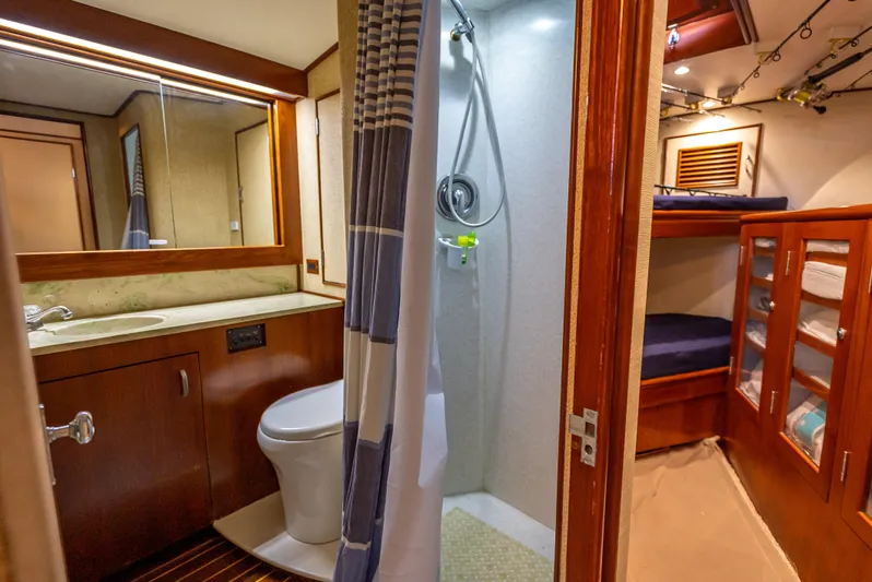 Andiamo Yacht Photos Pics Luxurious 1979 Merritt 46 yacht bathroom with shower and cozy cabin.