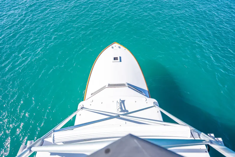 Andiamo Yacht Photos Pics Aerial view of 1979 Merritt 46 yacht on turquoise water.