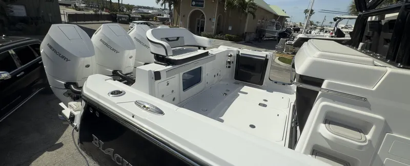 400-102 Yacht Photos Pics 2024 Blackfin 400 CC boat with triple Mercury engines, spacious deck, and modern seating.