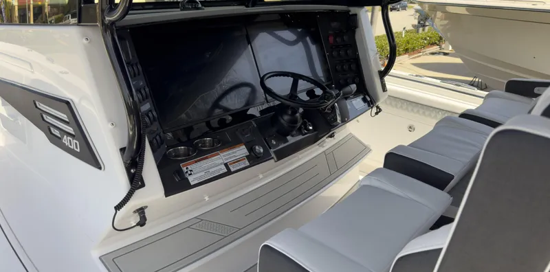 400-102 Yacht Photos Pics 2024 Blackfin 400 CC boat cockpit with dual steering wheels and modern controls.