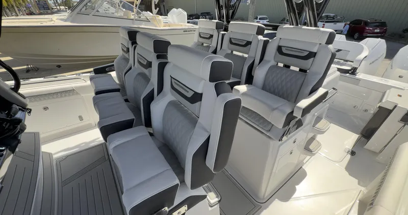 400-102 Yacht Photos Pics 2024 Blackfin 400 CC boat interior with luxurious seating arrangement.