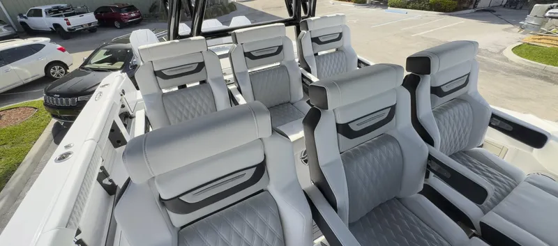 400-102 Yacht Photos Pics 2024 Blackfin 400 CC boat interior with luxurious seating arrangement.