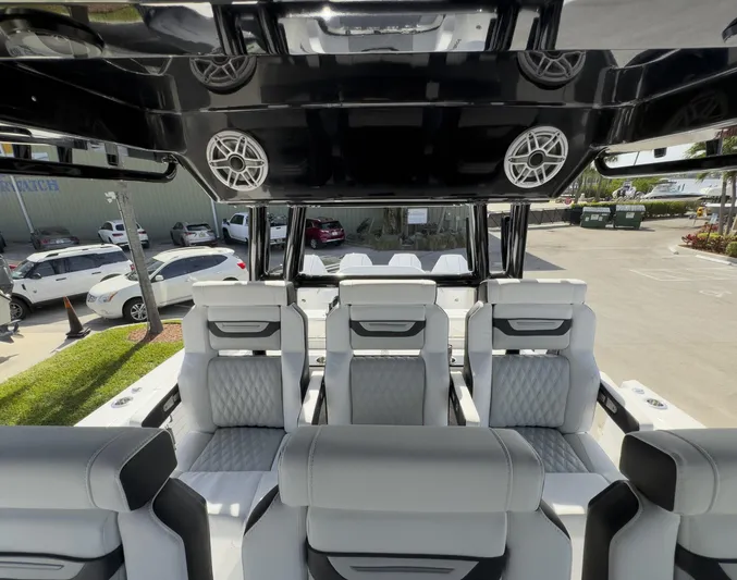 400-102 Yacht Photos Pics 2024 Blackfin 400 CC boat interior with luxurious seating and overhead speakers.