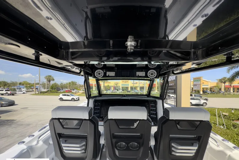 400-102 Yacht Photos Pics 2024 Blackfin 400 CC boat interior with three seats and modern dashboard.