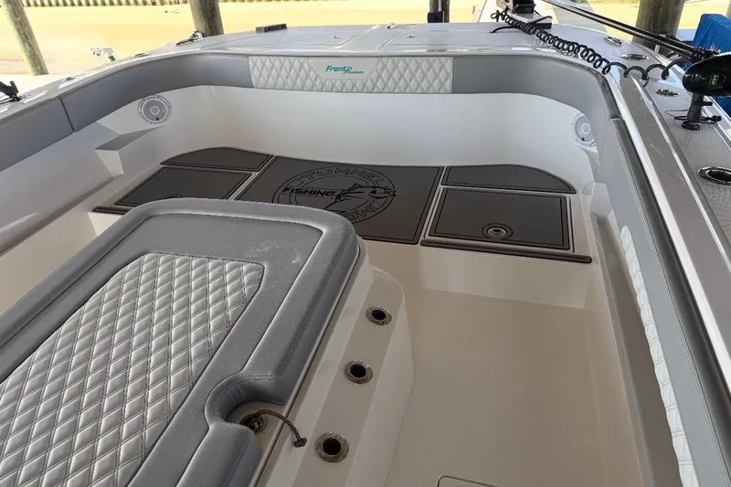  Yacht Photos Pics 2024 Front Runner 37 Catamaran interior with cushioned seating and fishing deck.