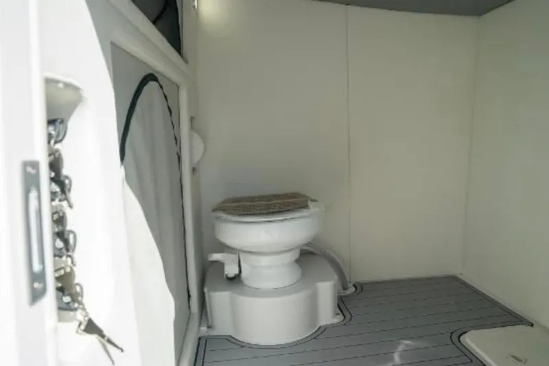  Yacht Photos Pics 2024 Front Runner 37 Catamaran bathroom interior with modern toilet and sleek design.