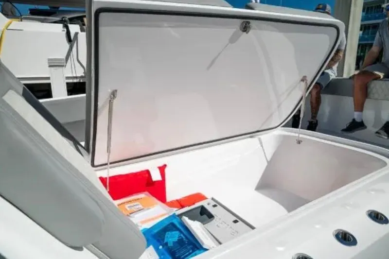  Yacht Photos Pics Open storage compartment on 2024 Front Runner 37 Catamaran, showcasing spacious interior.