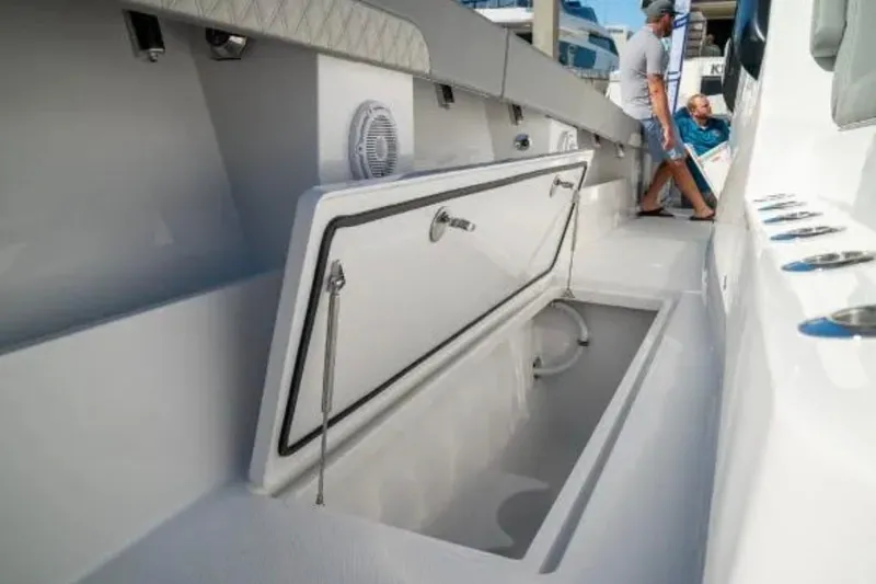 Yacht Photos Pics 2024 Front Runner 37 Catamaran interior storage compartment with open hatch, showcasing spacious design.
