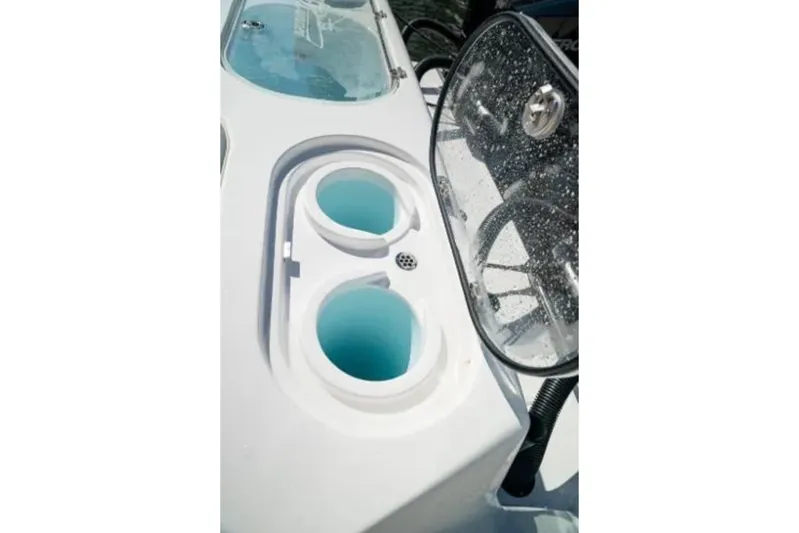  Yacht Photos Pics 2024 Front Runner 37 Catamaran's sleek deck with cup holders and windshield detail.