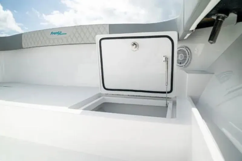  Yacht Photos Pics 2024 Front Runner 37 Catamaran interior storage compartment with open hatch, showcasing sleek design.