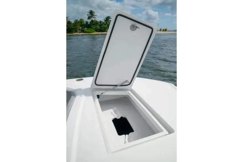  Yacht Photos Pics Open storage compartment on 2024 Front Runner 37 Catamaran, with ocean and island backdrop.