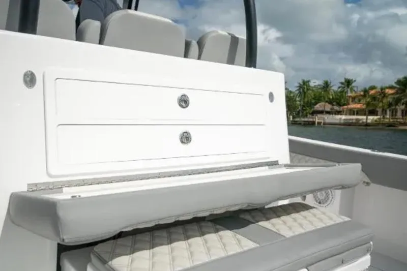  Yacht Photos Pics 2024 Front Runner 37 Catamaran interior seating with storage, featuring sleek design and coastal backdrop.