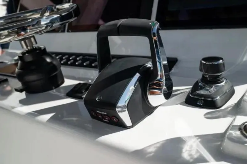  Yacht Photos Pics Control panel of 2024 Front Runner 37 Catamaran with steering wheel and throttle.