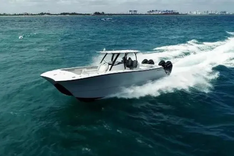  Yacht Photos Pics 2024 Front Runner 37 Catamaran cruising on open water, showcasing sleek design and performance.