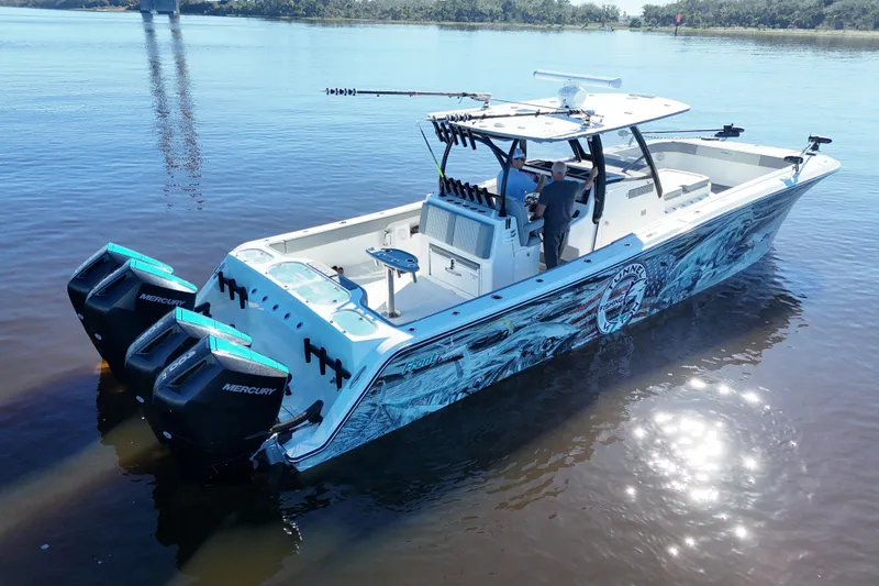  Yacht Photos Pics 2024 Front Runner 37 Catamaran with Mercury engines on calm water.