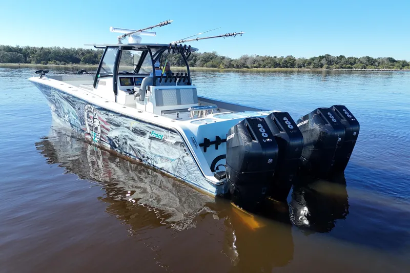  Yacht Photos Pics 2024 Front Runner 37 Catamaran with triple Mercury engines on calm water.