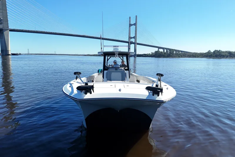  Yacht Photos Pics 2024 Front Runner 37 Catamaran on water near a bridge, clear sky.