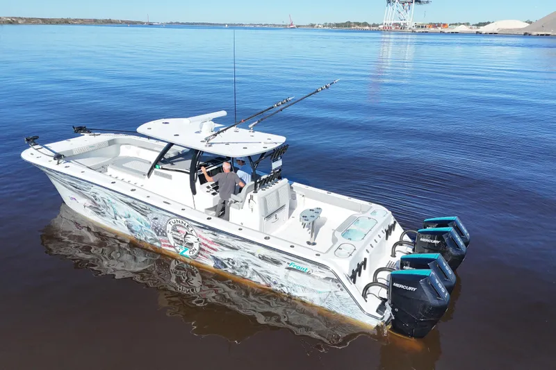  Yacht Photos Pics 2024 Front Runner 37 Catamaran on calm water, featuring powerful Mercury engines.