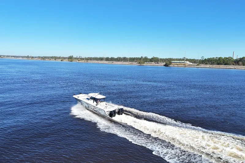  Yacht Photos Pics 2024 Front Runner 37 Catamaran cruising on a sunny day in open water.