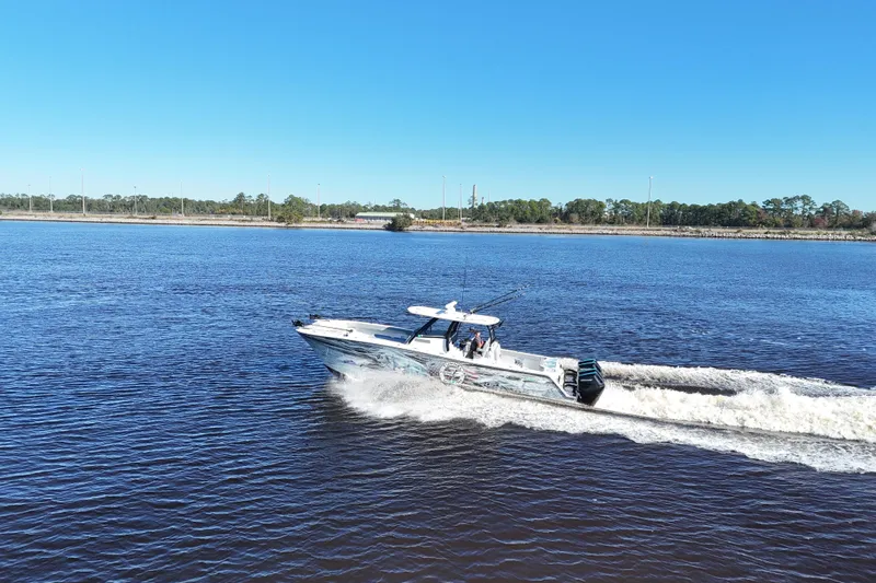  Yacht Photos Pics 2024 Front Runner 37 Catamaran cruising on a sunny day in open water.