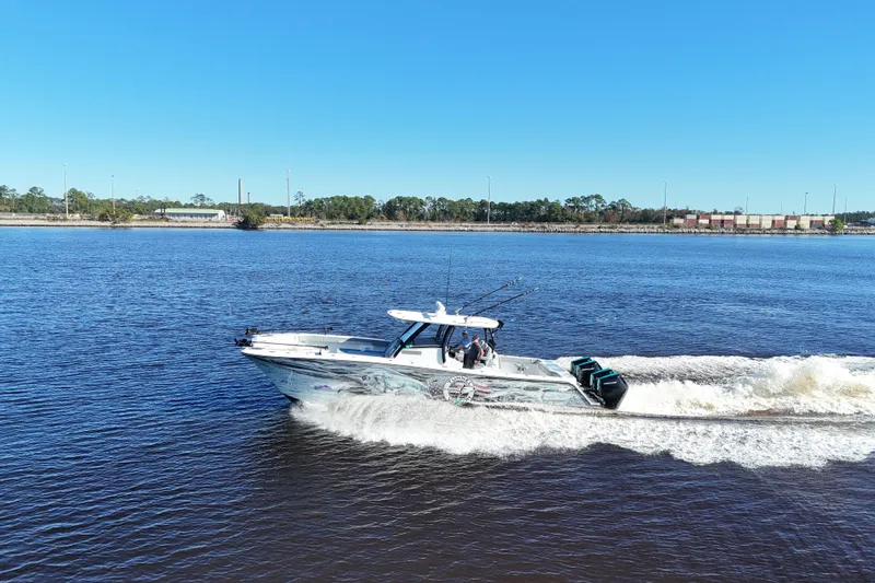  Yacht Photos Pics 2024 Front Runner 37 Catamaran cruising on a sunny day, showcasing sleek design and performance.