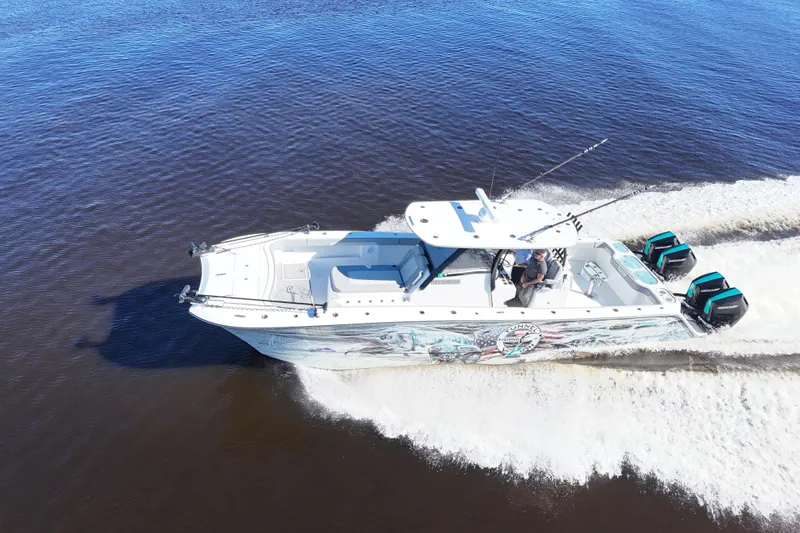  Yacht Photos Pics 2024 Front Runner 37 Catamaran cruising on open water, showcasing sleek design and powerful engines.