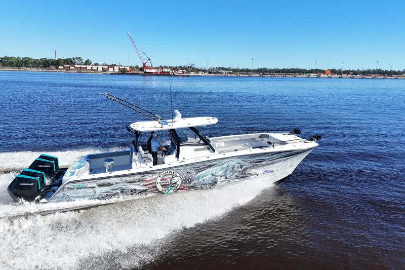  Yacht Photos Pics 2024 Front Runner 37 Catamaran cruising on a sunny day with dual Mercury engines.