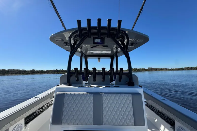  Yacht Photos Pics 2024 Front Runner 37 Catamaran on calm water, showcasing sleek design and spacious deck.