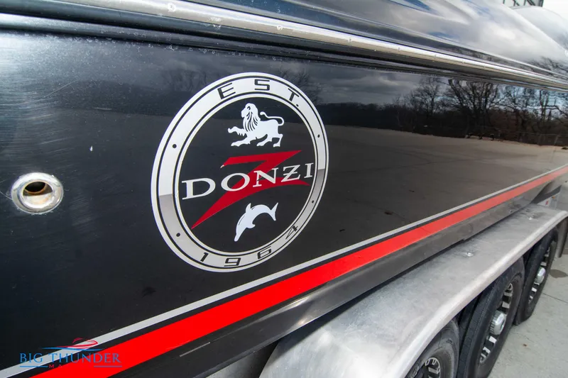  Yacht Photos Pics 2009 Donzi 38 ZRC boat with logo and red stripe on trailer.