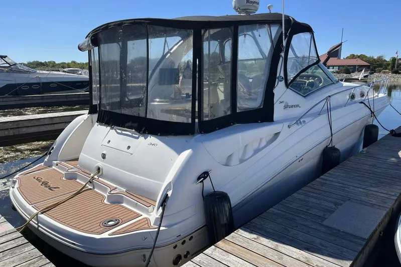  Yacht Photos Pics 2007 Sea Ray 340 Sundancer docked at marina, featuring sleek design and covered cockpit.