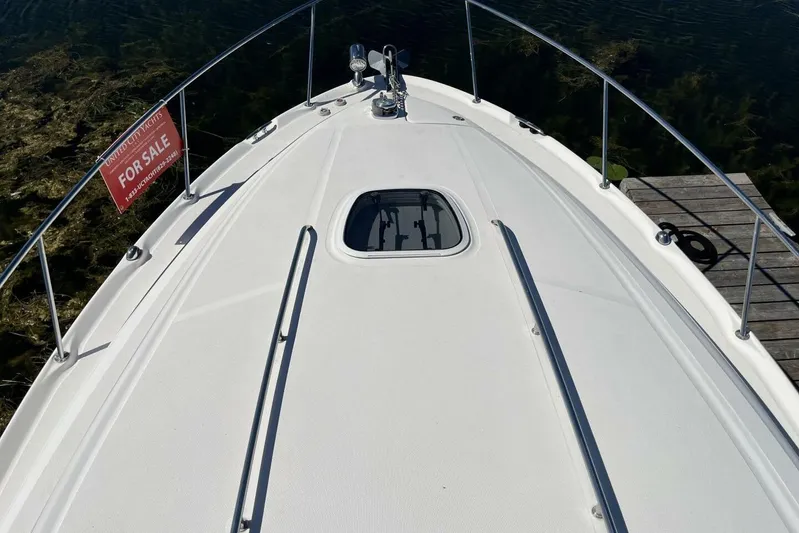  Yacht Photos Pics 2007 Sea Ray 340 Sundancer boat for sale, docked with clear water view.