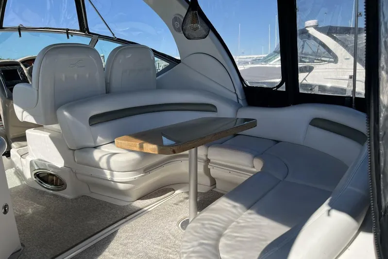  Yacht Photos Pics 2007 Sea Ray 340 Sundancer interior with white leather seating and wooden table.