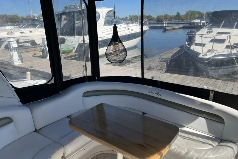  Yacht Photos Pics Interior of 2007 Sea Ray 340 Sundancer yacht with docked boats in background.