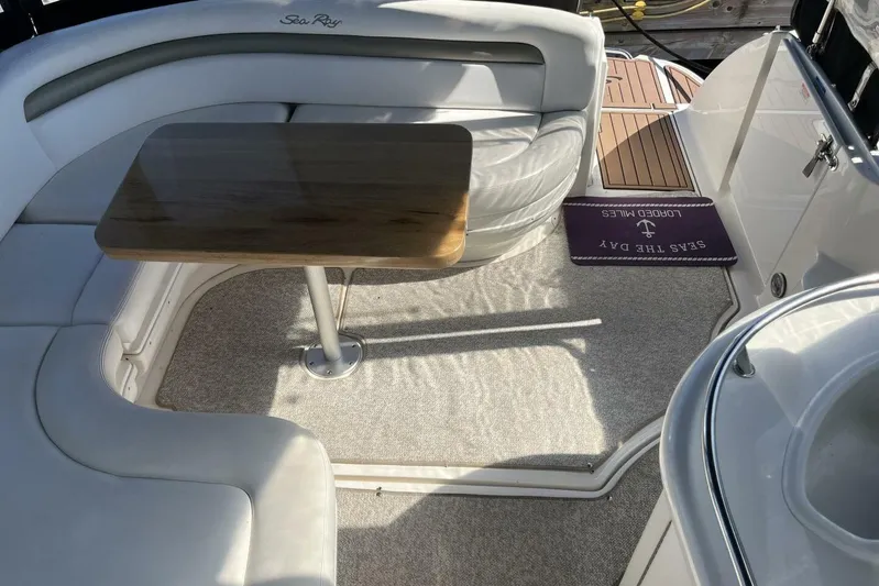  Yacht Photos Pics 2007 Sea Ray 340 Sundancer interior with cushioned seating and wooden table.