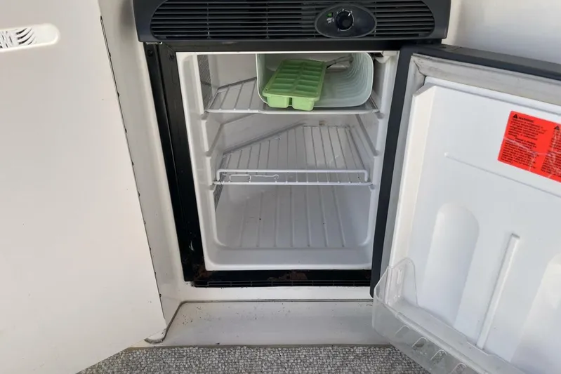  Yacht Photos Pics Open mini fridge on 2007 Sea Ray 340 Sundancer boat, with ice tray inside.