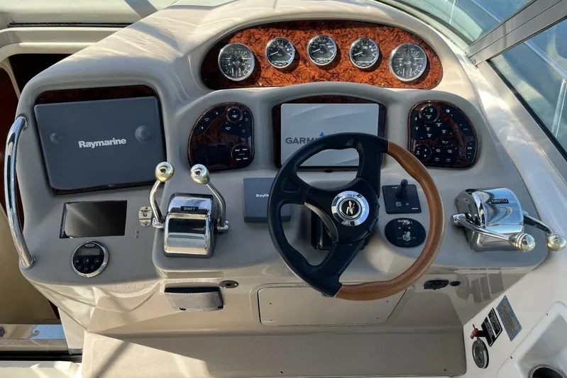  Yacht Photos Pics 2007 Sea Ray 340 Sundancer helm with Raymarine and Garmin navigation systems.