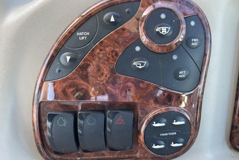  Yacht Photos Pics Control panel of a 2007 Sea Ray 340 Sundancer boat with various switches and buttons.