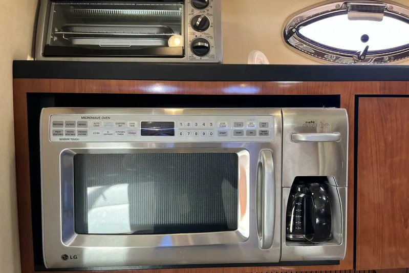  Yacht Photos Pics Microwave and coffee maker in 2007 Sea Ray 340 Sundancer yacht kitchen.
