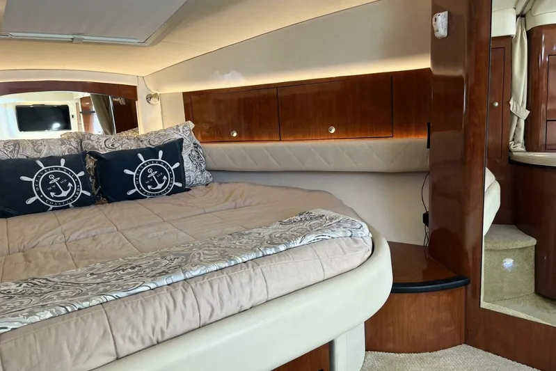  Yacht Photos Pics Luxurious cabin interior of 2007 Sea Ray 340 Sundancer yacht with cozy bedding.