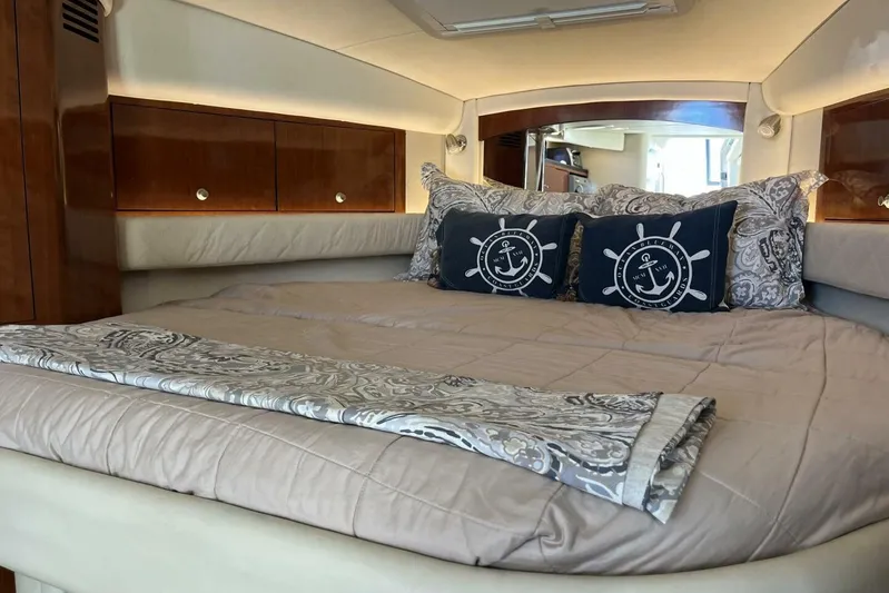  Yacht Photos Pics Luxurious cabin interior of 2007 Sea Ray 340 Sundancer yacht with elegant bedding.