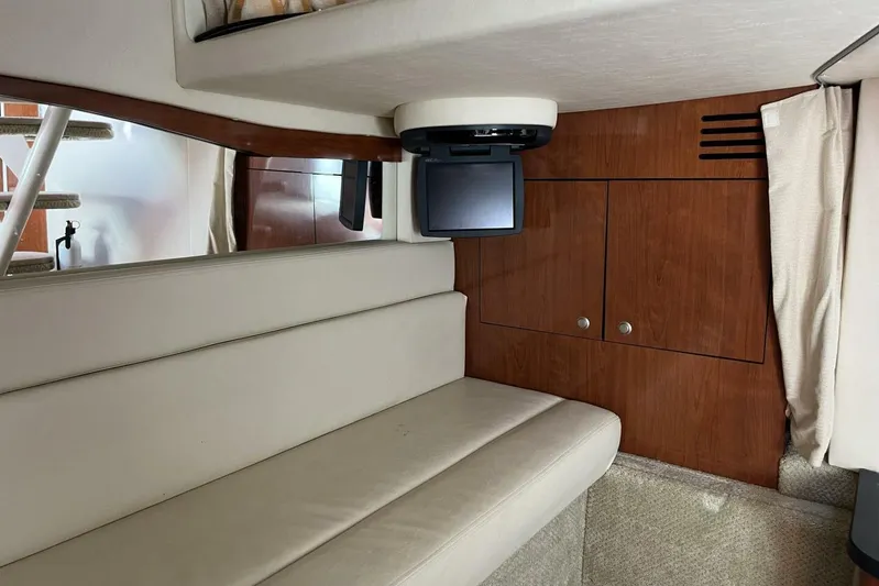  Yacht Photos Pics Interior of 2007 Sea Ray 340 Sundancer with beige seating and wood cabinetry.