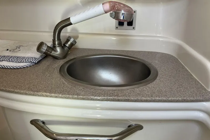  Yacht Photos Pics 2007 Sea Ray 340 Sundancer boat sink with dual-handle faucet and countertop.