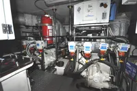 Engine room of 2010 Trader 64 Sunliner yacht with complex machinery and equipment.