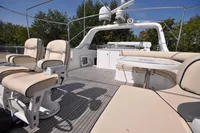 Luxurious 2010 Trader 64 Sunliner yacht deck with plush seating and modern amenities.
